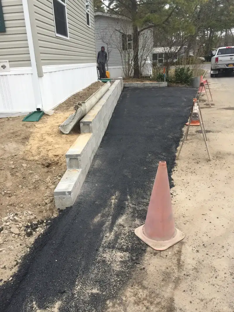 Asphalt and Stone Wall Repair - After