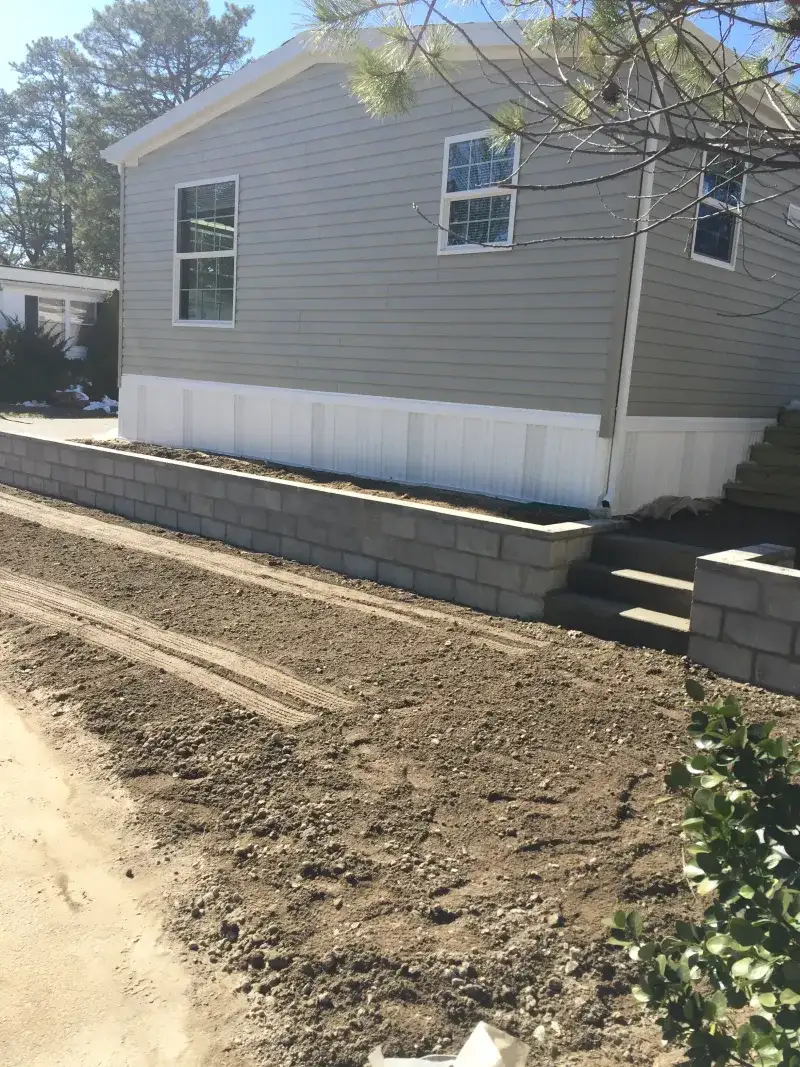 Asphalt and Stone Wall Repair - Before